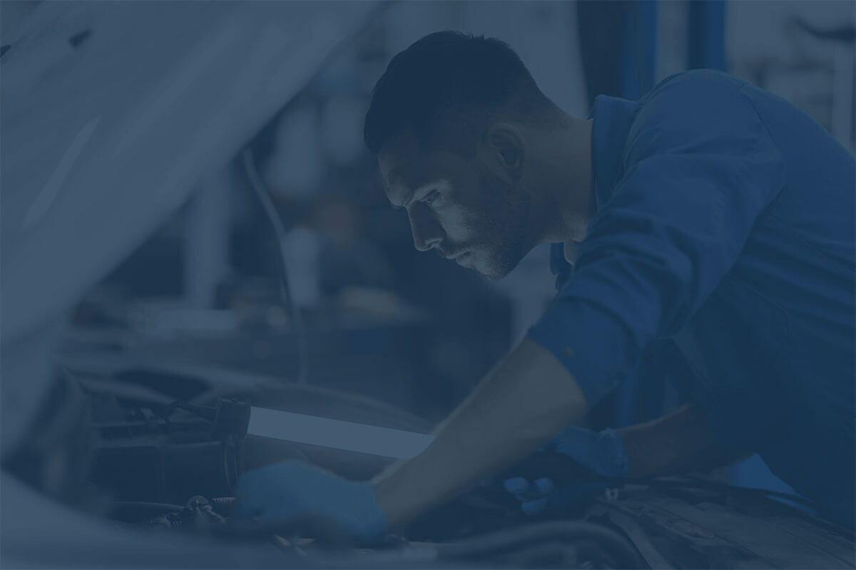 Technician working on a vehicle
